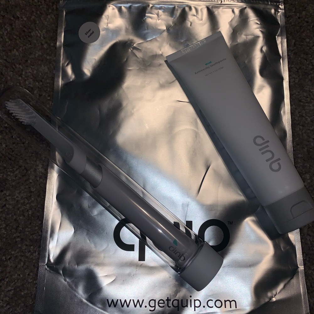 Quip silver metal electric toothbrush & toothpaste
